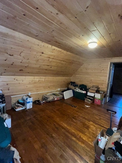 bonus room featuring hardwood / wood-style floors, wooden walls, lofted ceiling, and wood ceiling