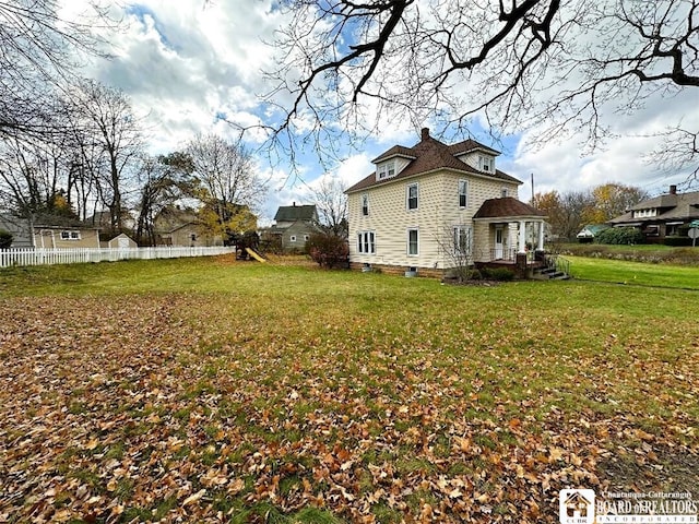 view of property exterior featuring a lawn