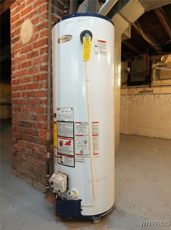 utility room featuring gas water heater