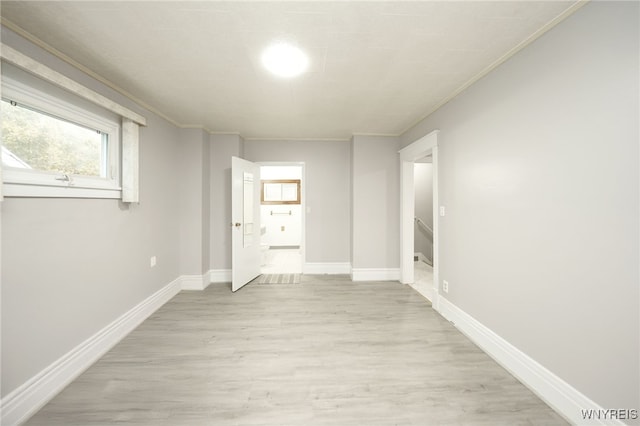 interior space featuring light hardwood / wood-style flooring and ornamental molding