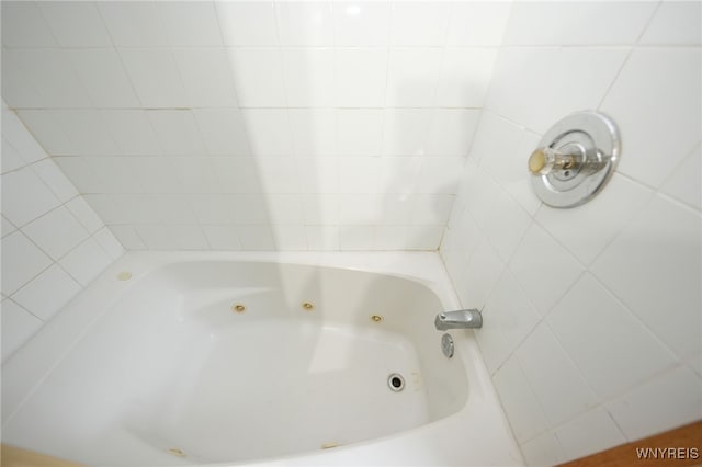 bathroom featuring a tub to relax in