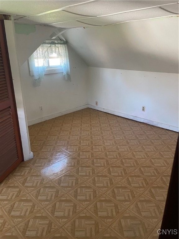 bonus room with vaulted ceiling