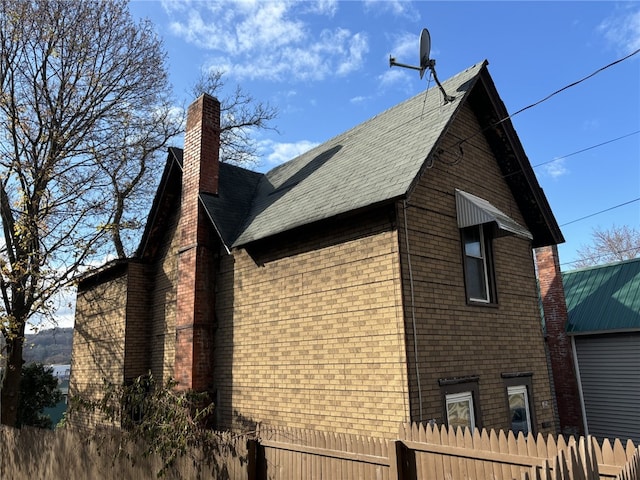 107 E Main St, Hornell, NY 14843 - view of home's exterior with a chimney