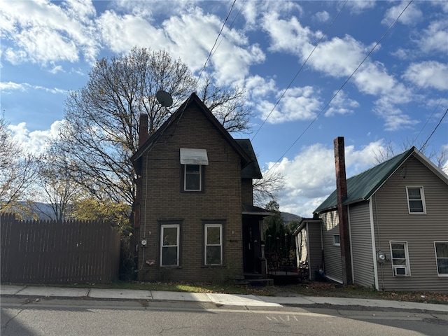 107 E Main St, Hornell, NY 14843 - view of front of home featuring brick siding and a chimney