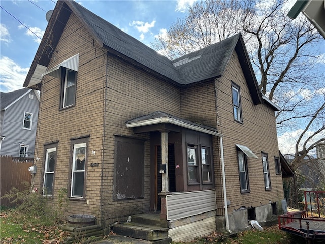 107 E Main St, Hornell, NY 14843 - view of front of home with brick siding and roof with shingles