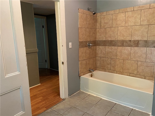 bathroom featuring hardwood / wood-style floors and tiled shower / bath combo