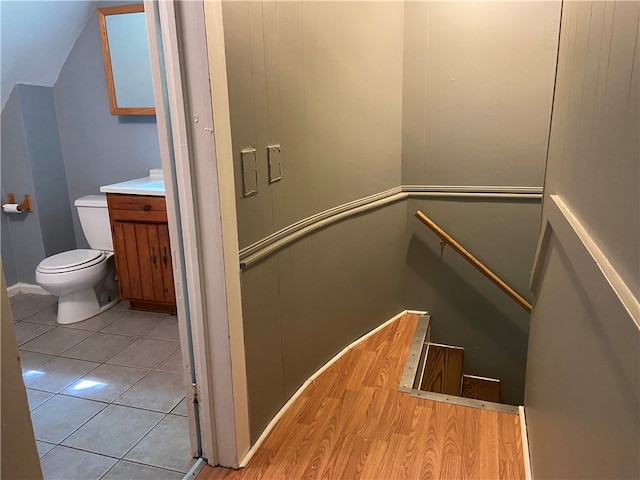 stairs featuring hardwood / wood-style flooring