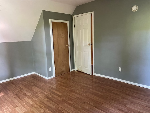 bonus room with hardwood / wood-style flooring and lofted ceiling