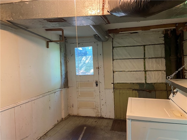 basement with hardwood / wood-style floors and washer / clothes dryer