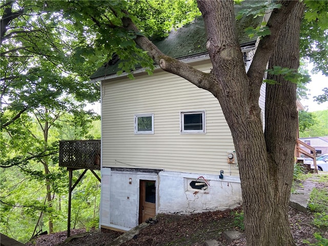 view of side of home with a deck