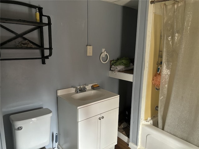 full bathroom with vanity, hardwood / wood-style flooring, toilet, and shower / bath combo with shower curtain