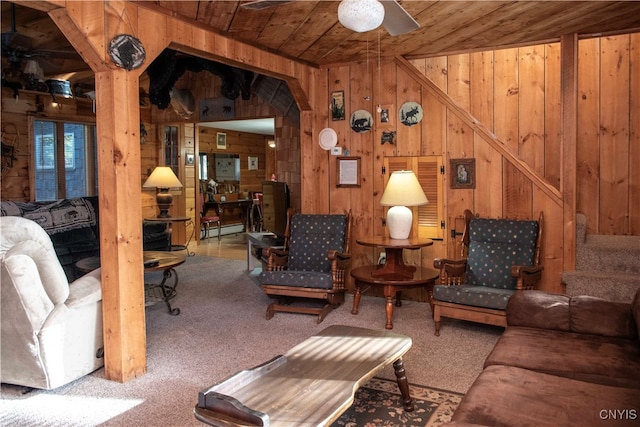 living room with wooden ceiling and wooden walls