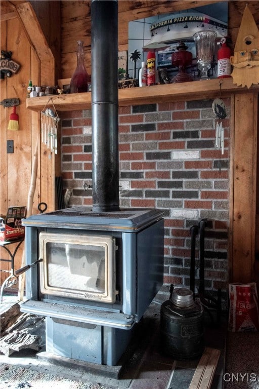 room details with a wood stove and wooden walls