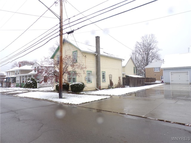 view of property exterior with a garage