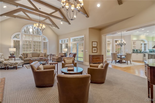 living room featuring beam ceiling, plenty of natural light, high vaulted ceiling, and light wood-type flooring