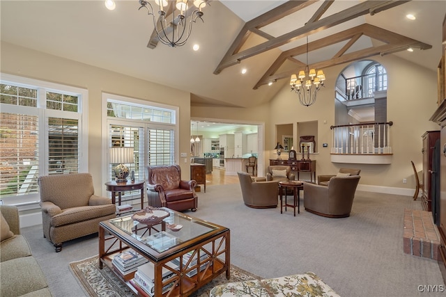 carpeted living room with a notable chandelier, a healthy amount of sunlight, and high vaulted ceiling