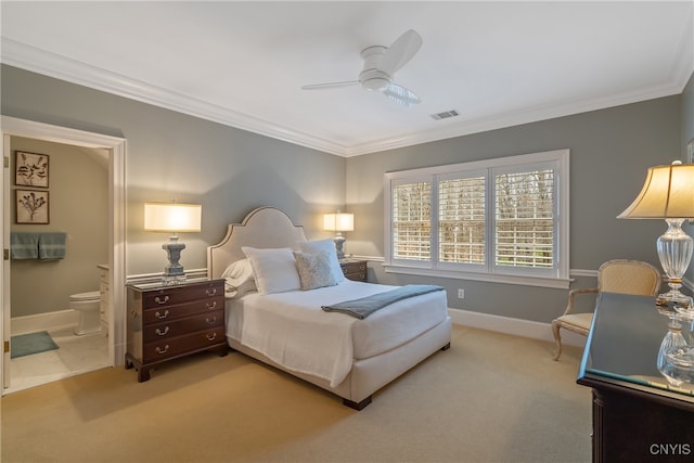 carpeted bedroom with ensuite bathroom, ceiling fan, and crown molding