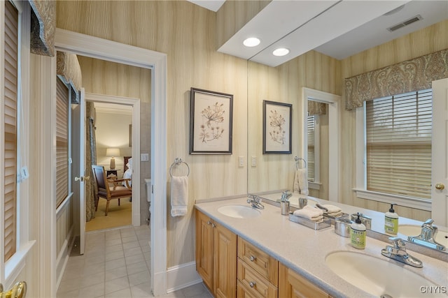 bathroom featuring tile patterned flooring and vanity