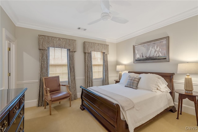 carpeted bedroom featuring ceiling fan and ornamental molding