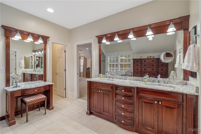 bathroom featuring tile patterned flooring and vanity