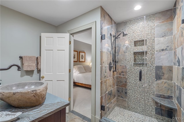 bathroom featuring vanity and an enclosed shower