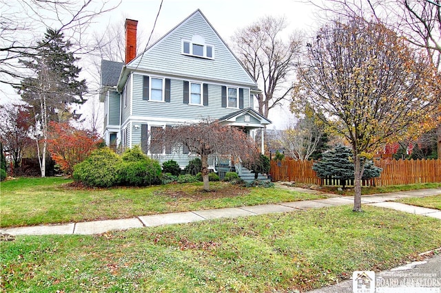 view of front property with a front lawn