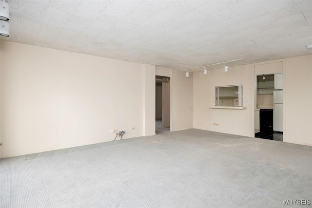 unfurnished room featuring carpet floors