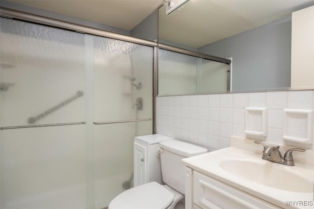 bathroom featuring an enclosed shower, tile walls, and tasteful backsplash