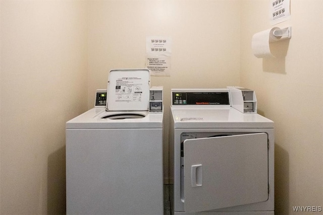 washroom featuring washer and clothes dryer