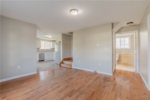 unfurnished living room with light hardwood / wood-style flooring