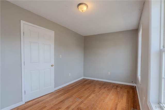 spare room featuring light hardwood / wood-style flooring