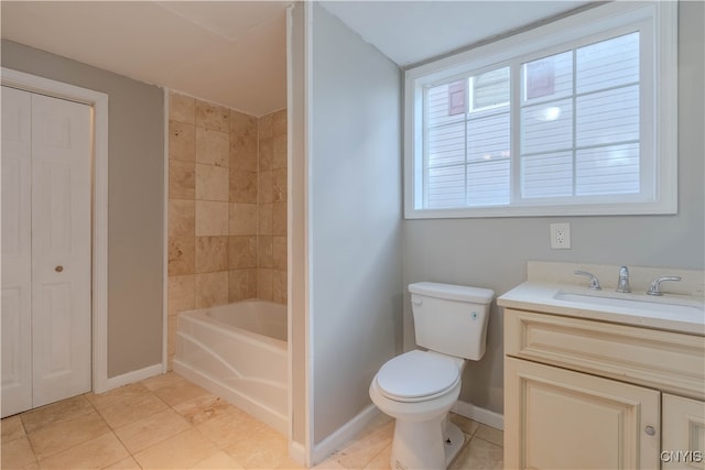 full bathroom with tile patterned flooring, vanity, tiled shower / bath combo, and toilet