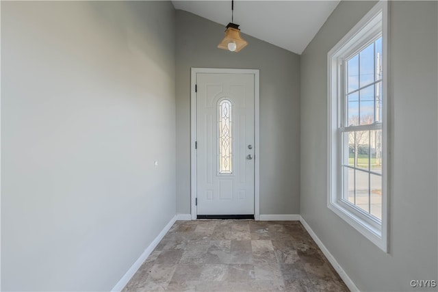 foyer featuring a healthy amount of sunlight and lofted ceiling