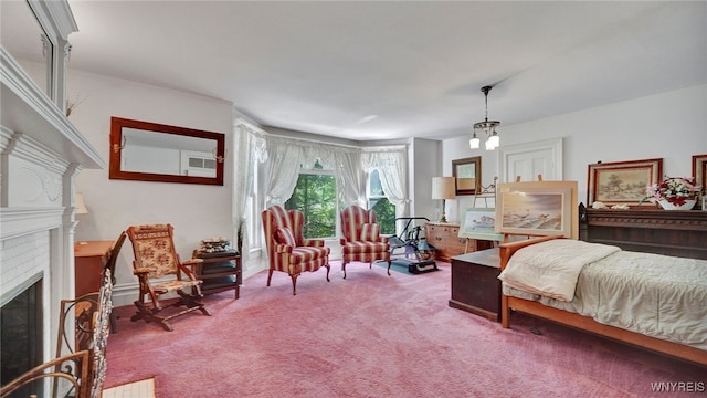 bedroom with carpet, a chandelier, and a brick fireplace