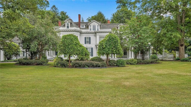 29 Willets Ave, Amity, NY 14813 - second empire-style home featuring a front yard and a chimney