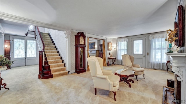 sitting room featuring light carpet