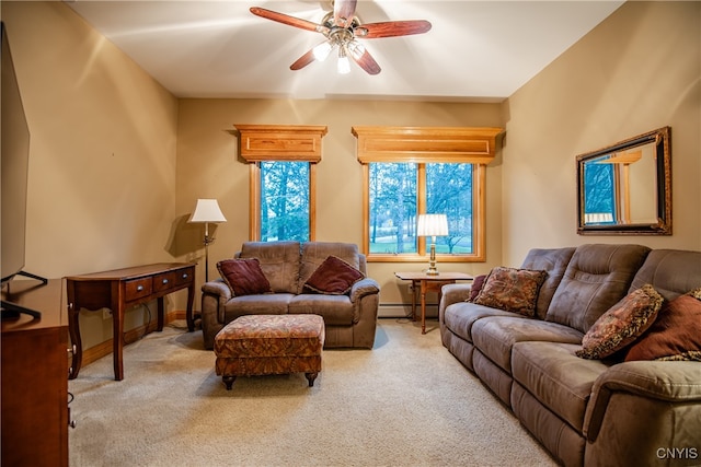 carpeted living room with a baseboard radiator and ceiling fan