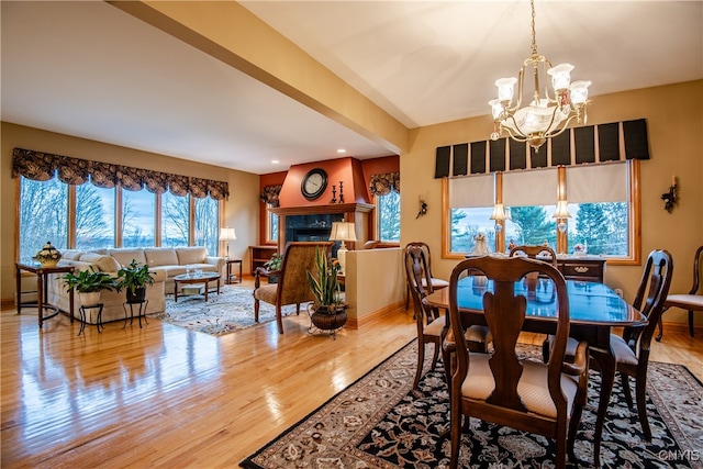 dining room featuring hardwood / wood-style floors and a notable chandelier