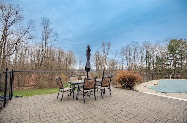 view of patio featuring a covered pool