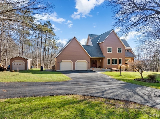 view of front facade featuring a front yard and a garage