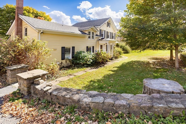 exterior space featuring a lawn