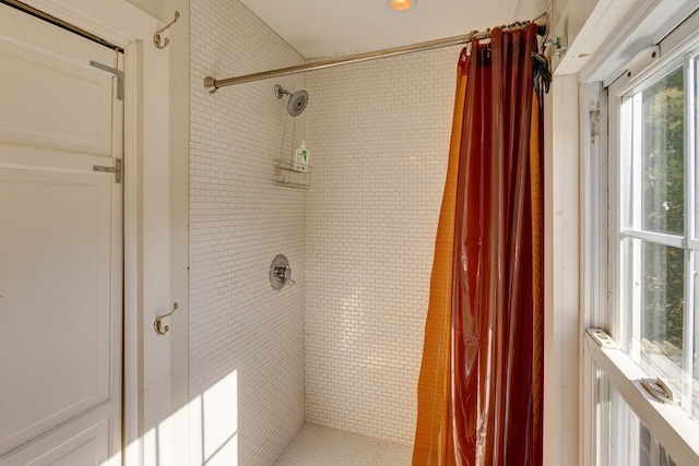 bathroom featuring a shower with curtain