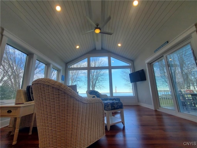 sunroom / solarium with vaulted ceiling, ceiling fan, and wood ceiling