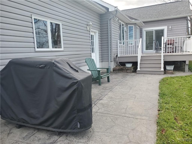 view of patio / terrace featuring grilling area and a deck