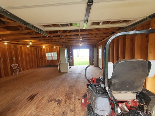 garage featuring wooden walls