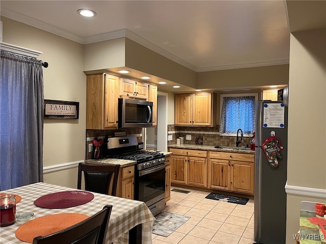 kitchen with appliances with stainless steel finishes, backsplash, crown molding, sink, and light tile patterned floors