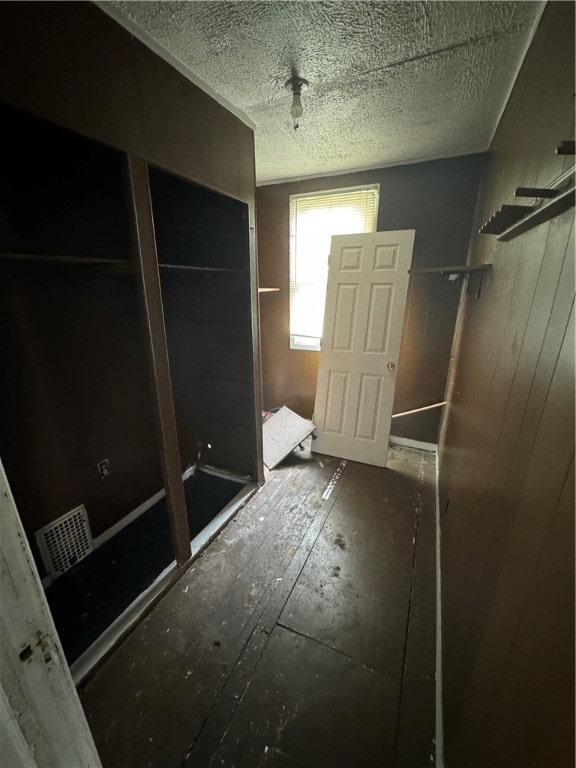 bathroom with wood walls