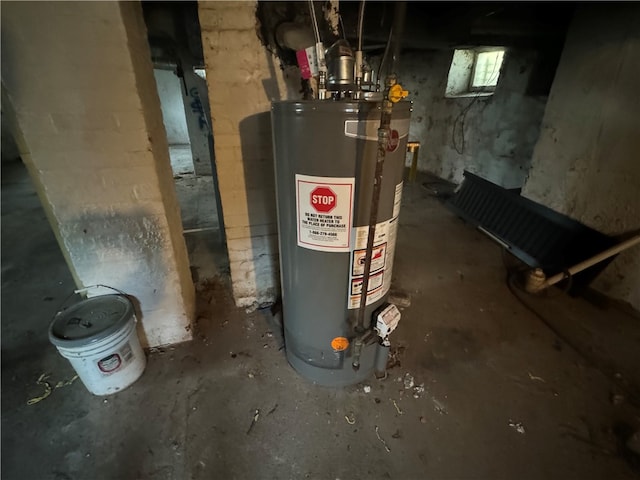 utility room with gas water heater