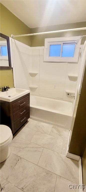 full bathroom with shower / bathing tub combination, vanity, and toilet