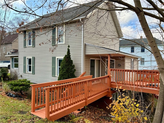 back of house featuring a deck